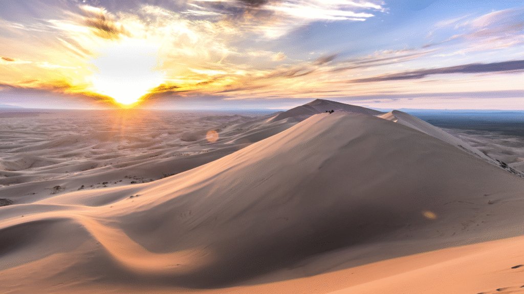 Sunrise Over Desert Dunes